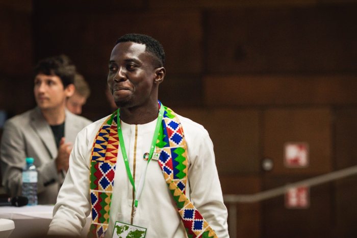 Emmanuel receiving an award
