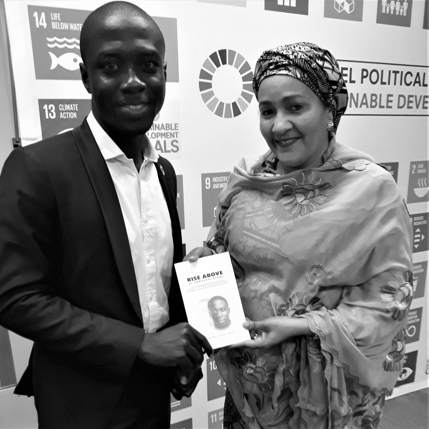 Emmanuel with UN Deputy Secretary-General Amina Mohammed, holding Rise Above